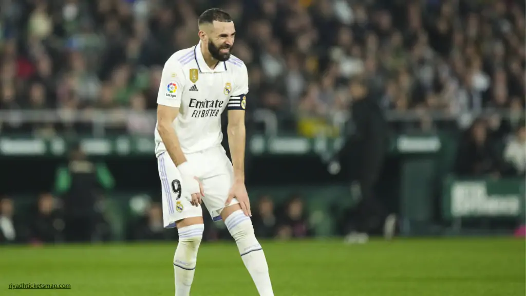 Benzema Injury Hands Ronaldo a Saudi Pro League Title Window 2 Karim Benzema reacts in pain while holding his leg during a La Liga match for Real Madrid, in an injury setback that could influence the Saudi Pro League title race involving Cristiano Ronaldo.